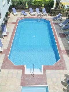 Renos Hotel Apts Полис Екстериор снимка